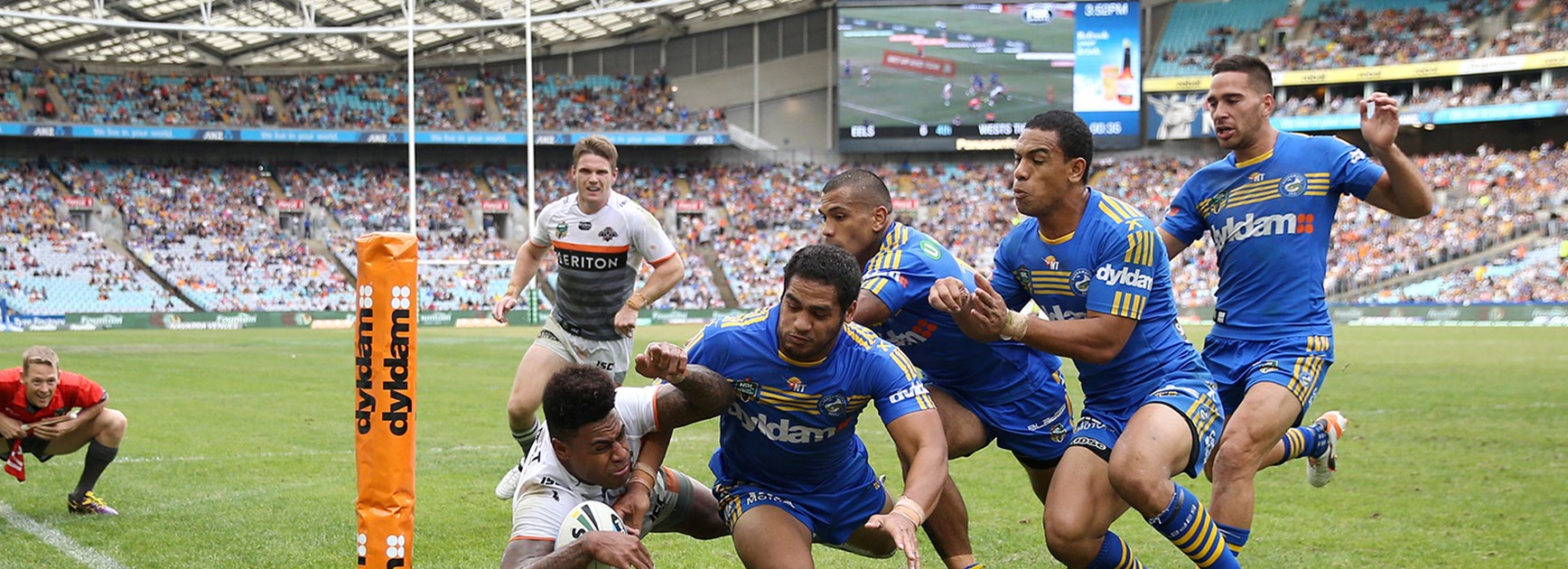 Kevin Naiqama scores in the corner despite the attention of four Eels defenders in Round 5 at ANZ Stadium.