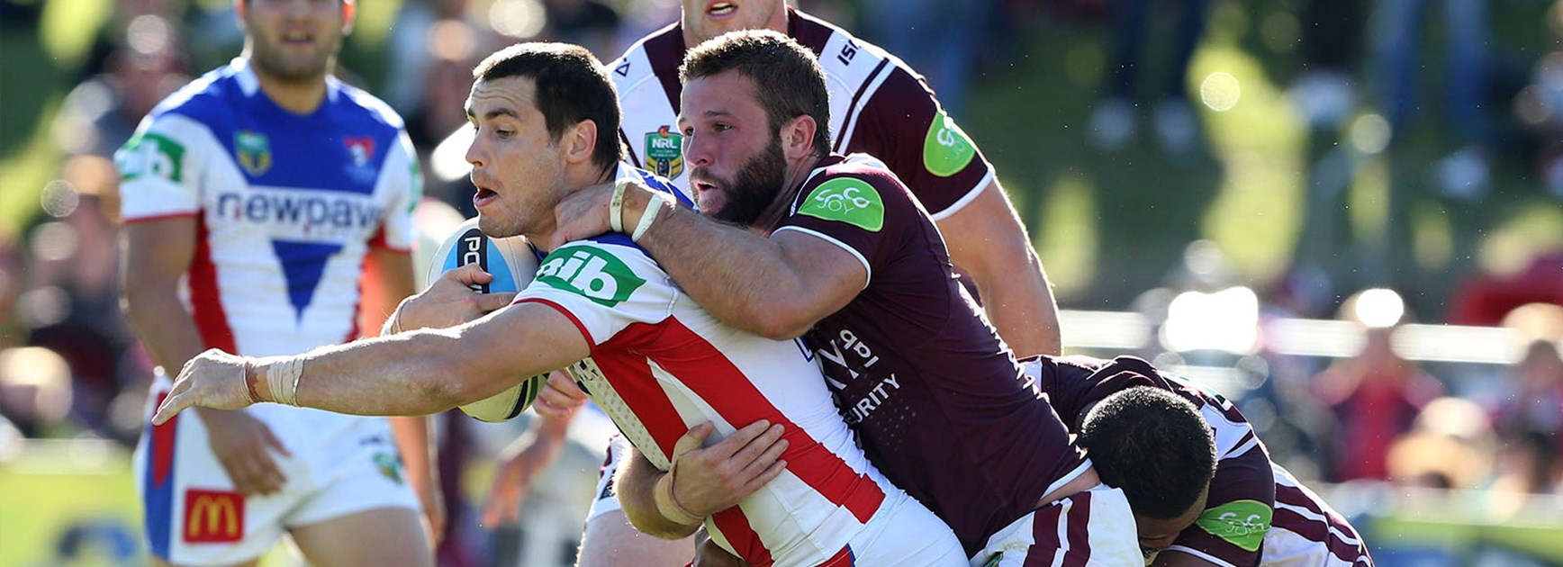 James McManus is tackled during the Knights clash with Manly at Brookvale Oval.