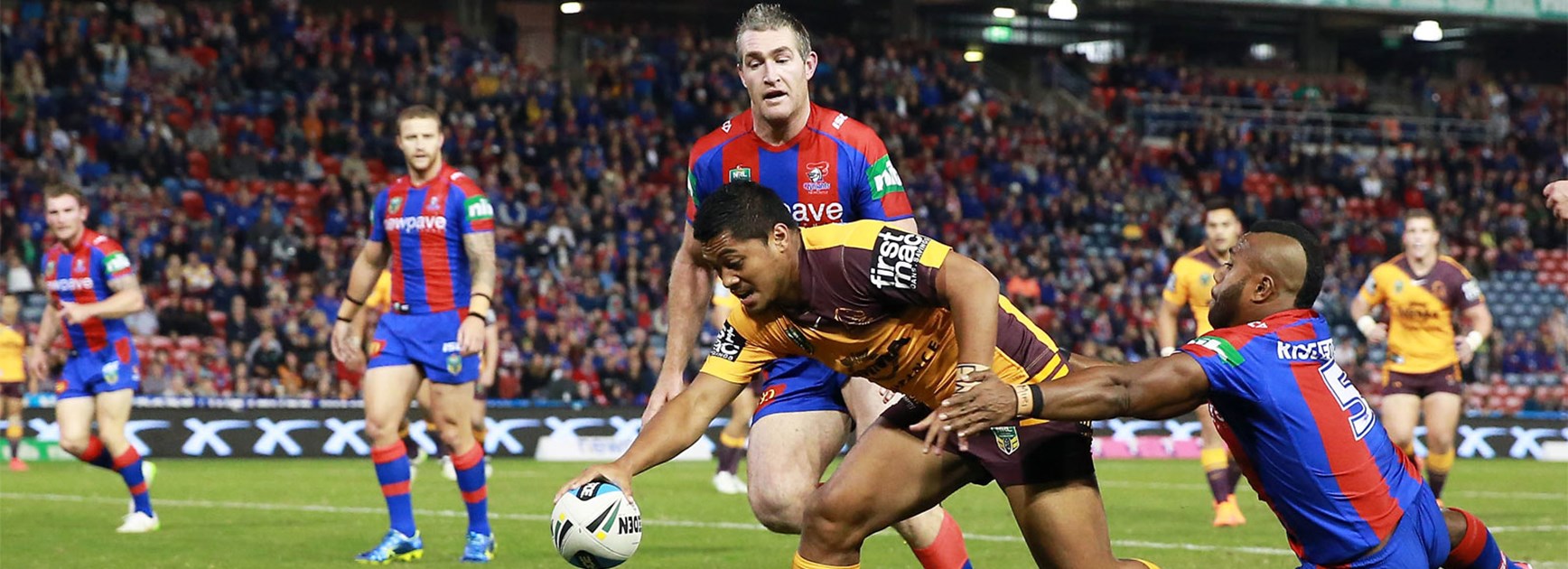Anthony Milford scores the opening try for Brisbane against Newcastle on Monday night.
