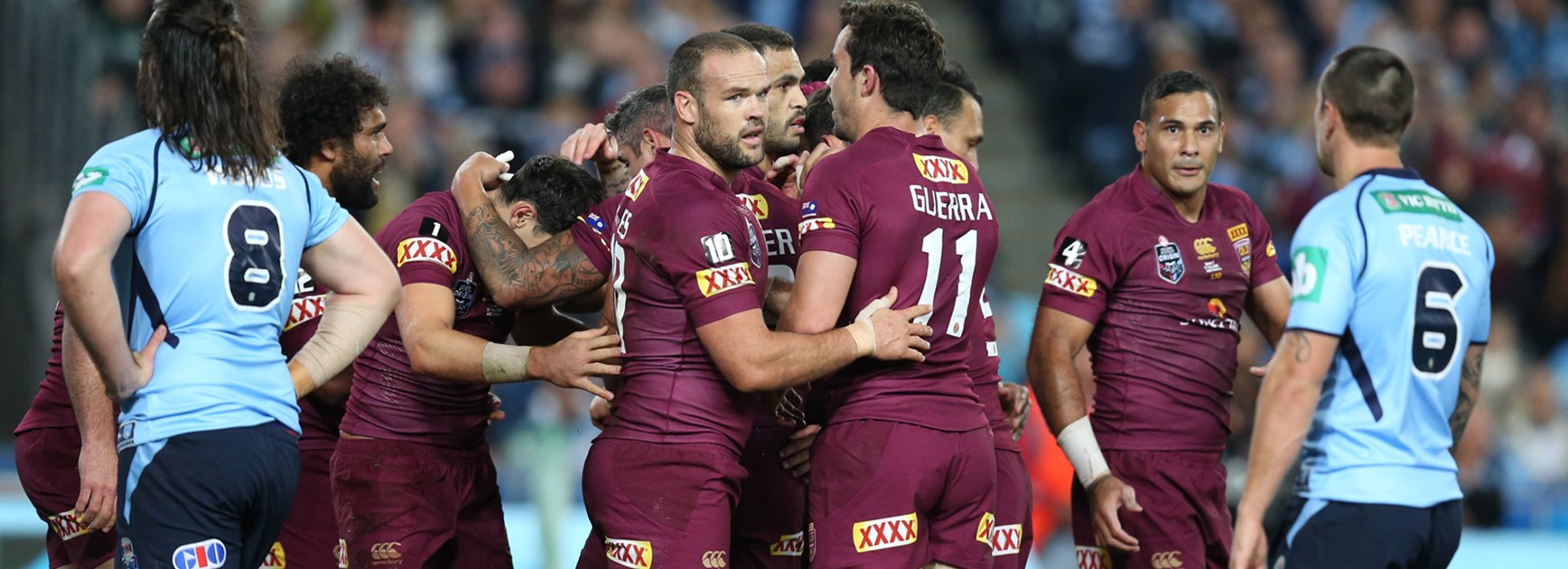 Queensland players celebrate their one-point win over NSW in Game One.