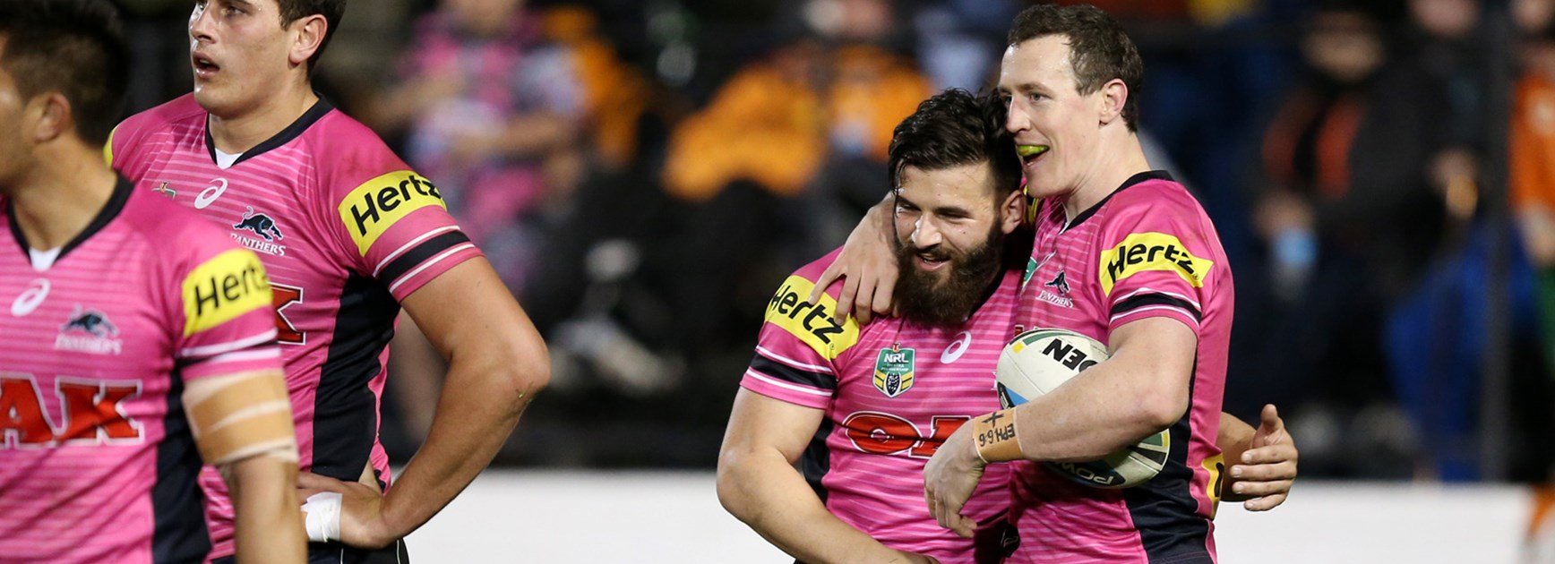 David Simmons celebrates with Josh Mansour following one of Simmons' four tries.