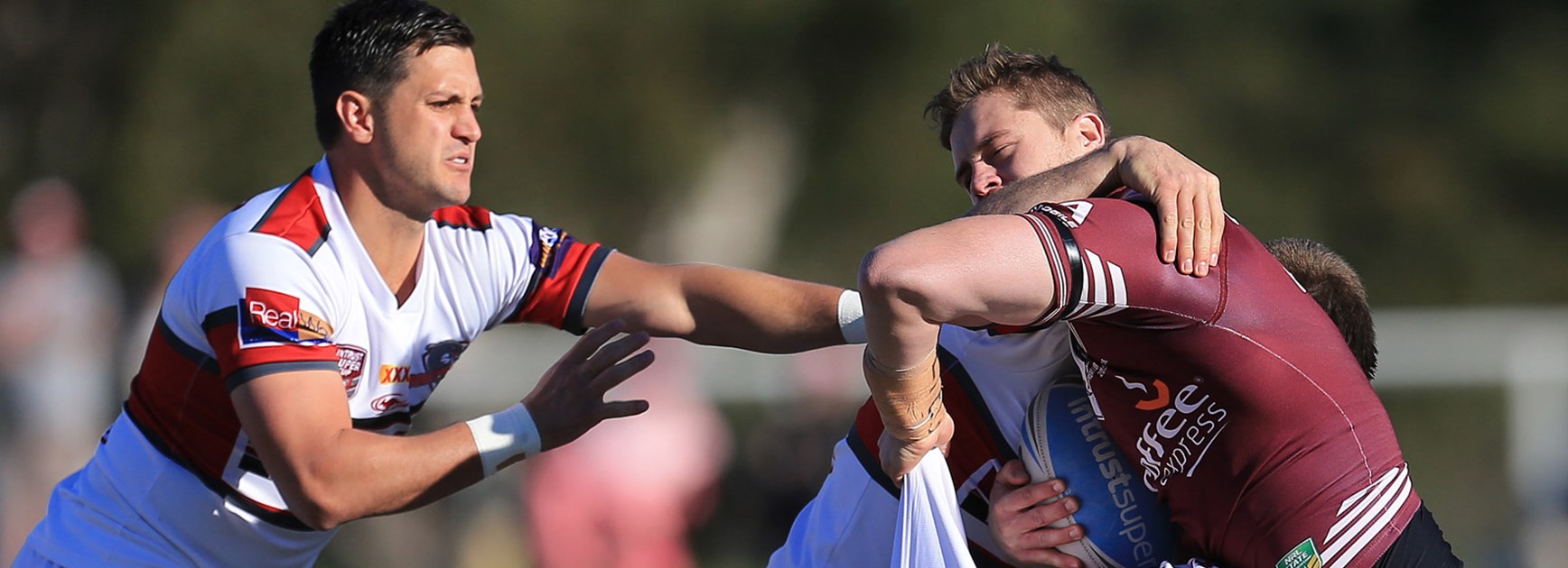 The Redcliffe defence swarms on Burleigh's Ayden Lee in their 64-6 drubbing of the Bears on Sunday.