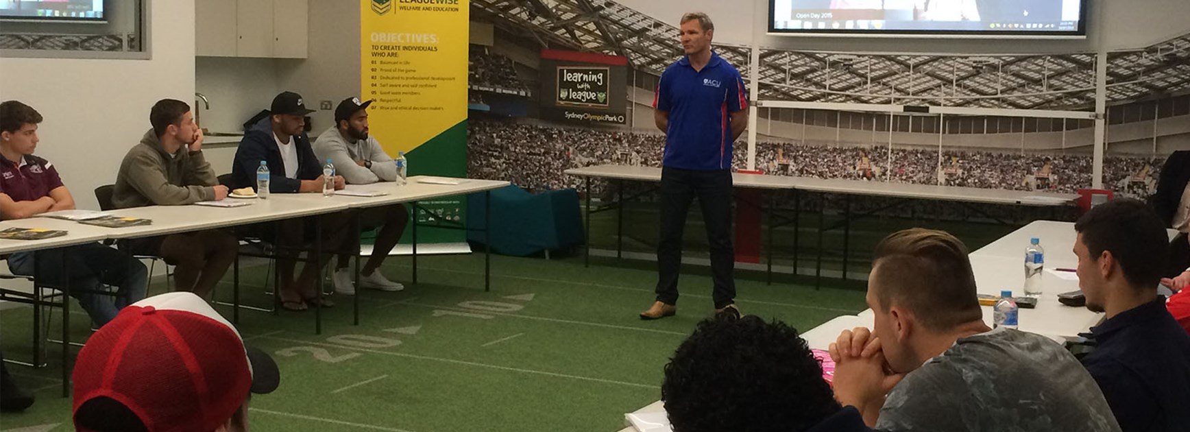 ACU and Broncos' Todd Lowrie addresses players during the NRL Graduates of Rugby League orientation day.