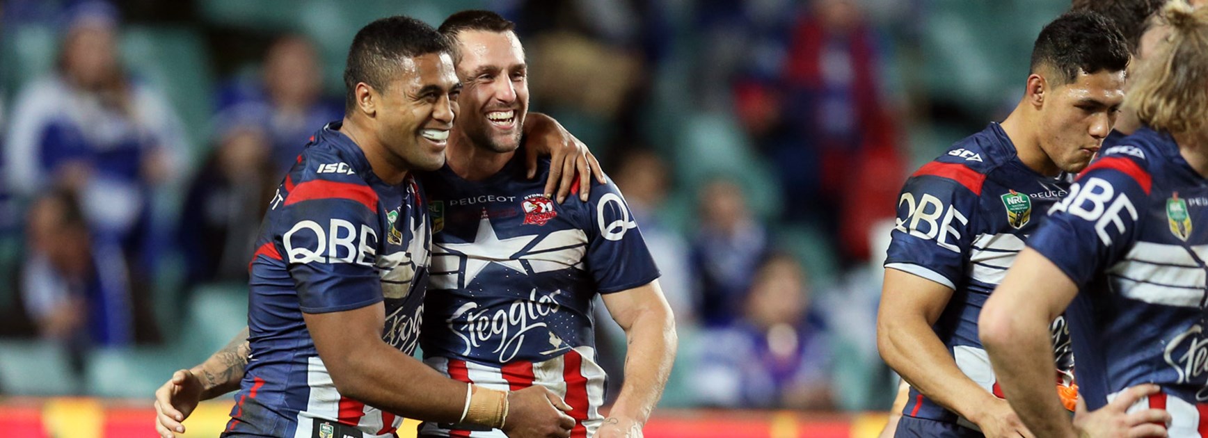 Mitchell Pearce and Michael Jennings celebrate their win over the Bulldogs.