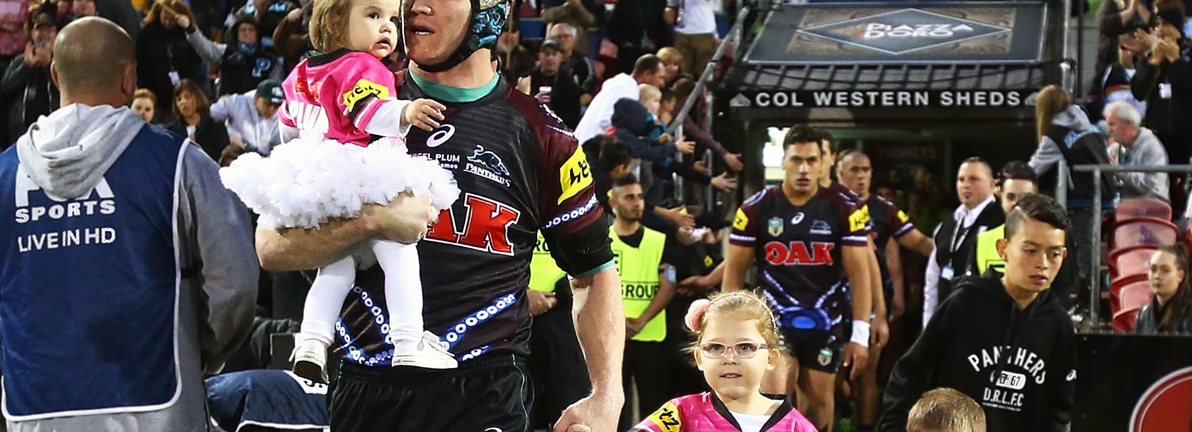 Nigel Plum and his children lead the Panthers onto the ground ahead of his final game in the NRL.