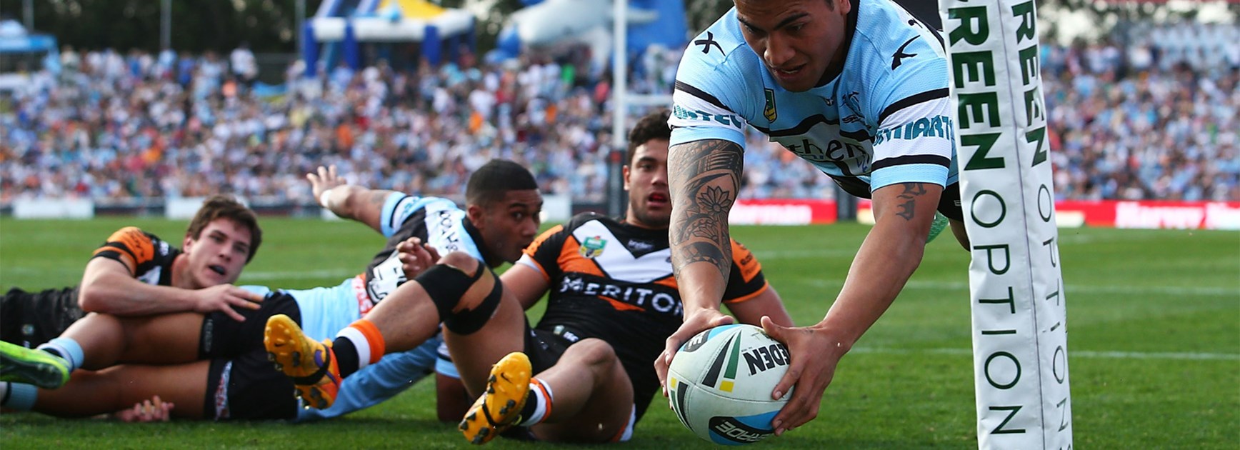 Sosaia Feki dives over to score the first of his try tries againt the Wests Tigers on Saturday.