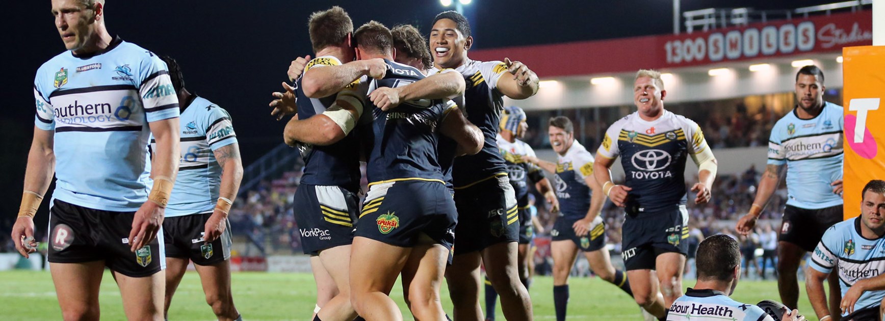 Cowboys players celebrate their semi-final victory over the Sharks at 1300SMILES Stadium.