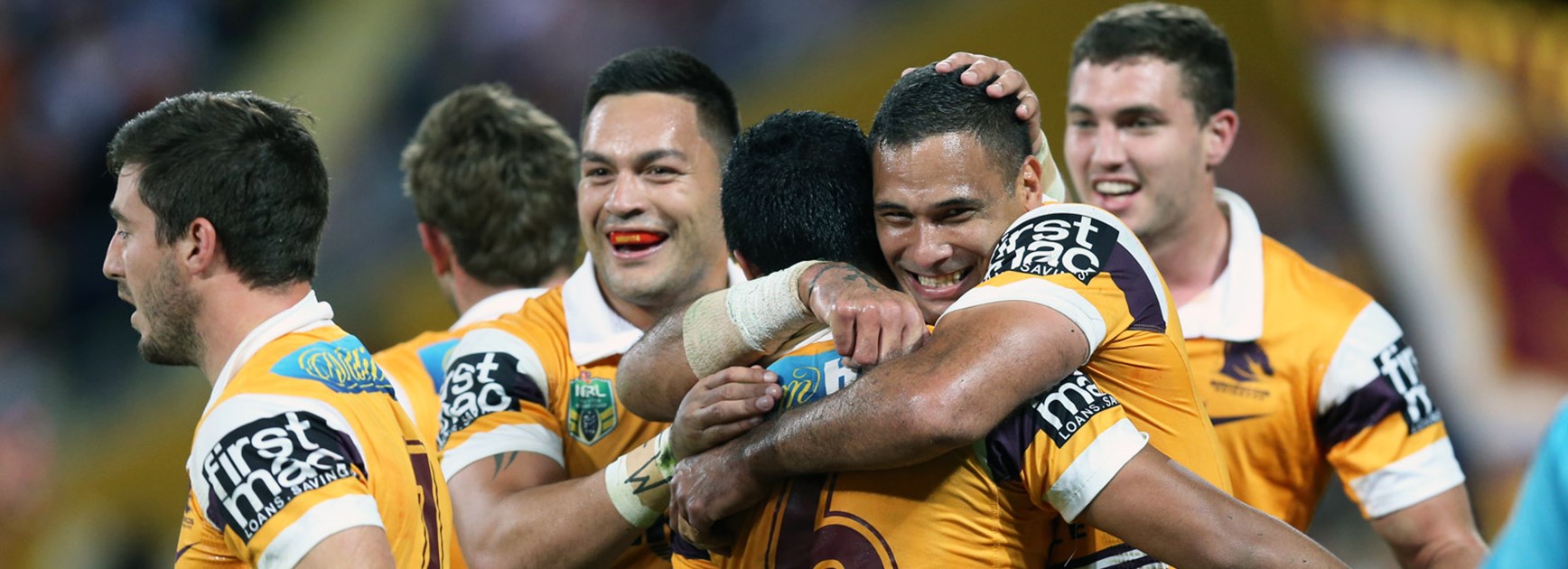 Broncos players celebrate during their preliminary final win over the Roosters.