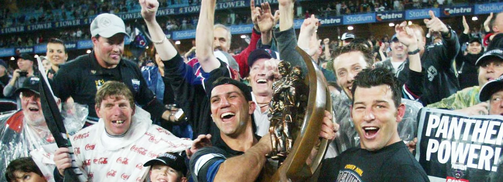 Scott Sattler celebrates winning the 2003 Grand Final with Craig Gower and Penrith fans.