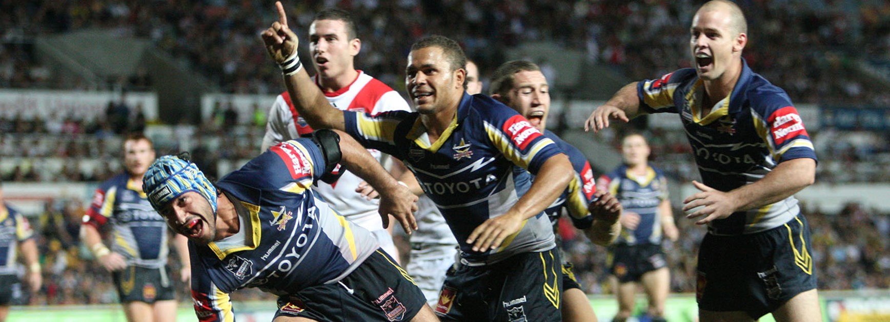 Matt Bowen celebrates with Johnathan Thurston during his time with the North Queensland Cowboys.