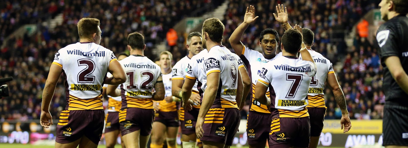 Broncos players celebrate during their big World Club Series win over Wigan.