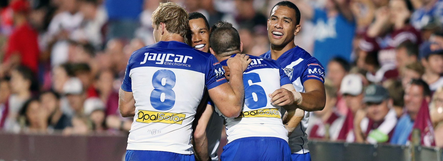 Bulldogs players celebrate during their Round 1 win at Brookvale Oval.