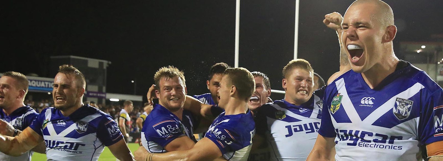 Bulldogs players celebrate their dramatic late win over Penrith in Round 2.