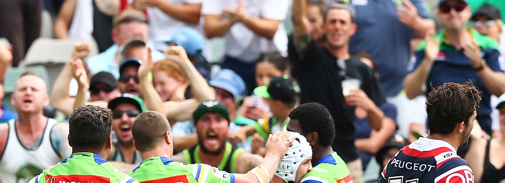 The Raiders celebrate Jarrod Croker's late try against the Roosters on Saturday.