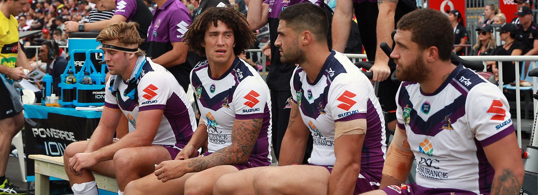 The Storm bench look on during their tight win over the Warriors in Round 3.