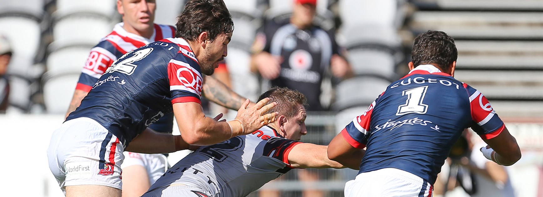 Ryan Hoffman is held back by the Roosters defence while trying to score a try in Round 5.