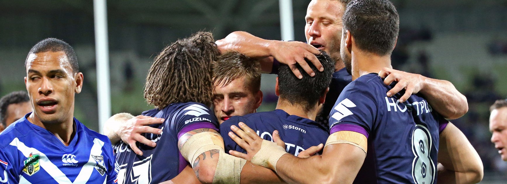 Storm players celebrate against the Bulldogs in Round 6.