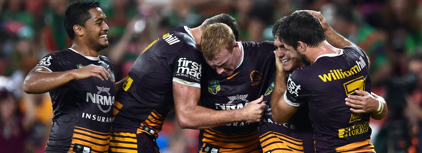 Broncos players celebrate against the Rabbitohs in Round 8.