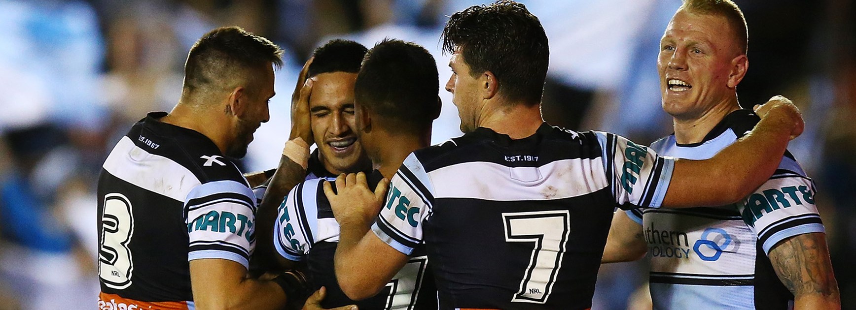 The Sharks celebrate Valentine Holmes's crucial try in Round 8.