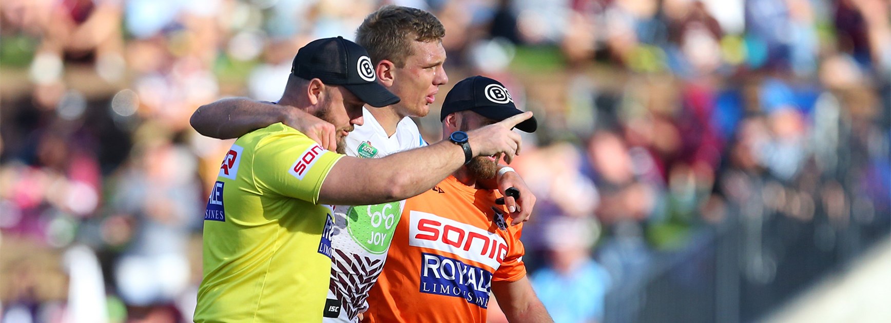 Tom Trbojevic is helped from the field during Manly's win over the Knights on Anzac Day.