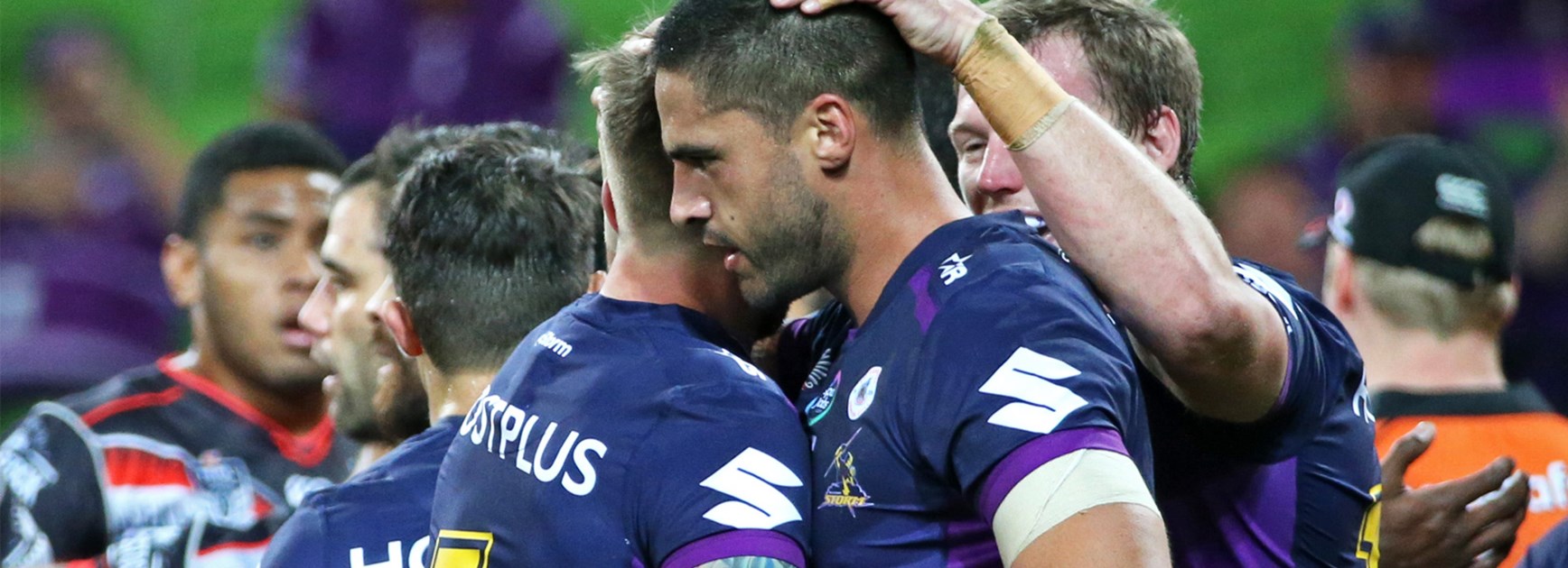The Storm celebrate Jesse Bromwich's first-half try against the Warriors on Monday night.