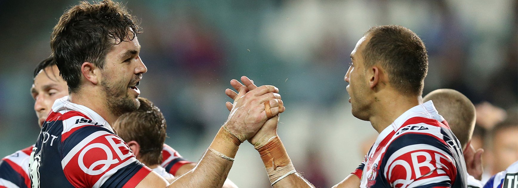 The Roosters celebrate Blake Ferguson's try against the Knights in Round 9.