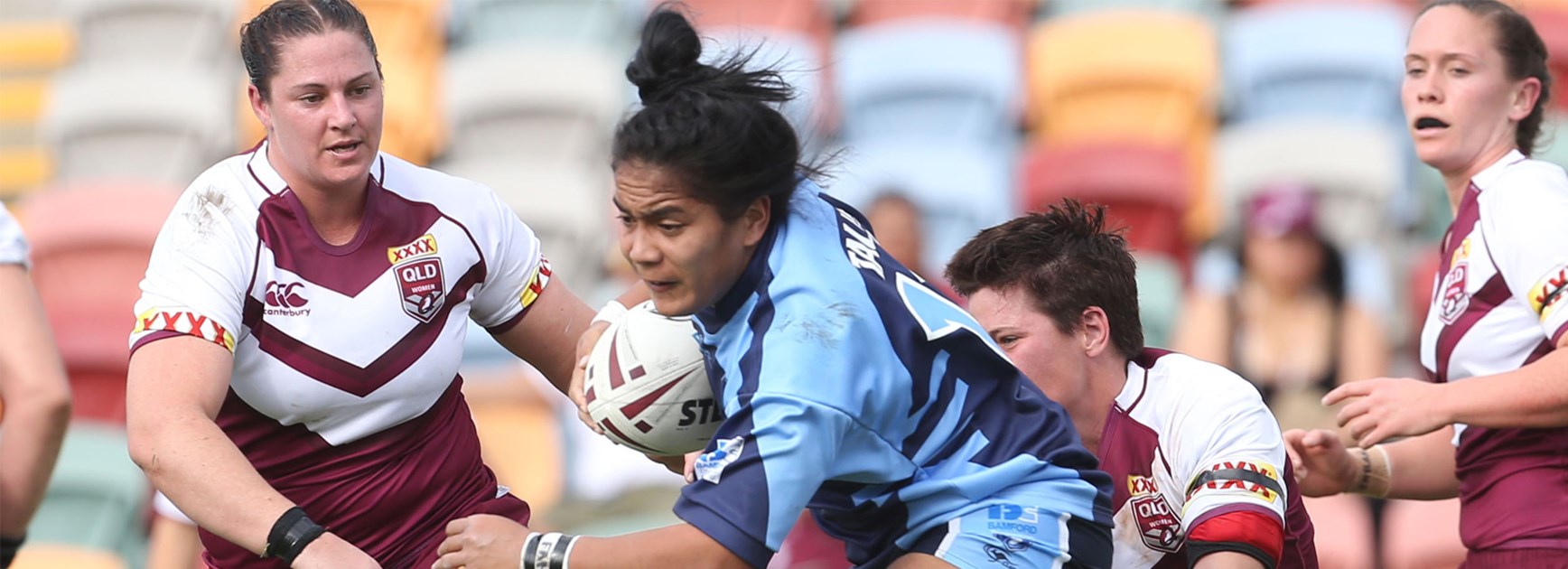 Simaima Tau takes a charge for the women's NSW team against Queensland on Saturday.