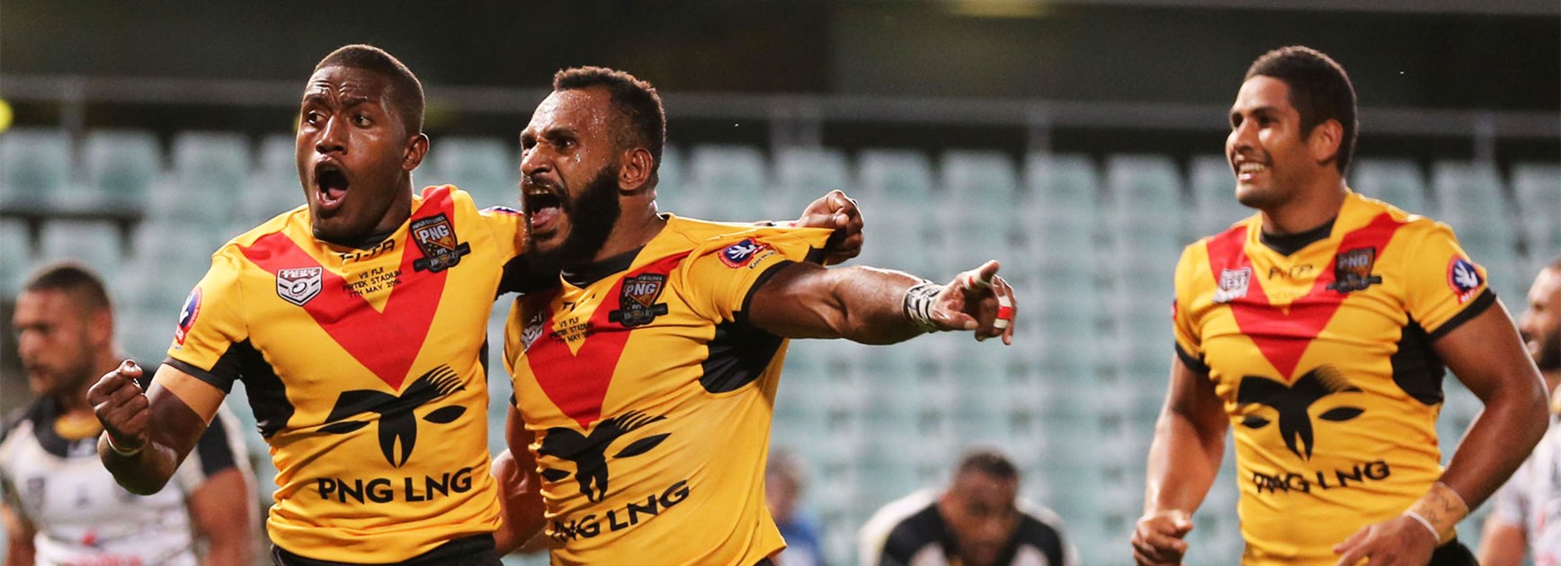 Papua New Guinea celebrate a try during their win over Fiji on Saturday night.