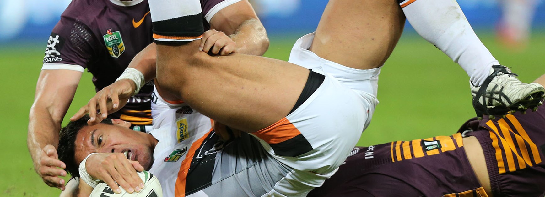 Elijah Taylor scores for the Wests Tigers against the Broncos.