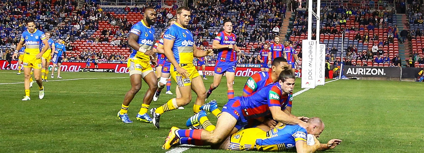 Former Knight Beau Scott scores for the Eels against his old club on Monday night.