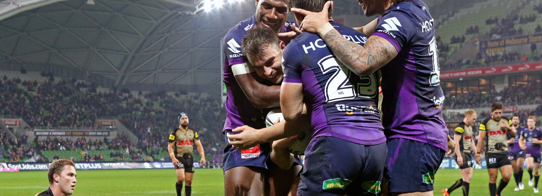 Storm players celebrate against the Panthers in Round 13.