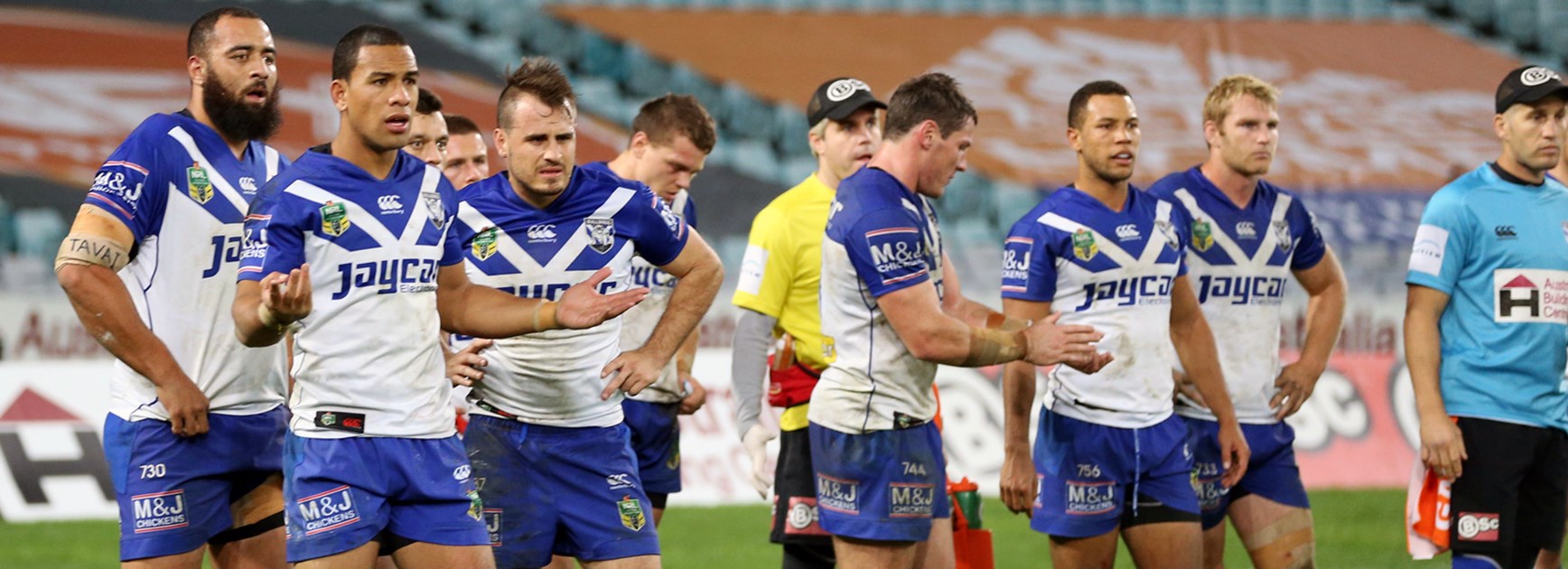 Bulldogs players look on dejected during their Round 13 loss to the Sharks.