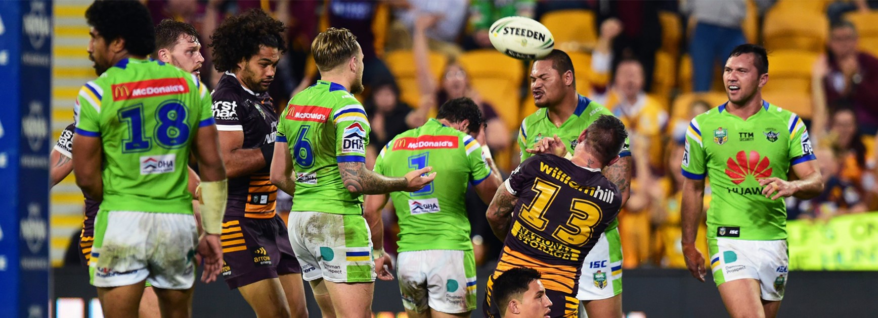 Raiders players look on as Corey Parker celebrates scoring the Broncos' opening try on Thursday night.
