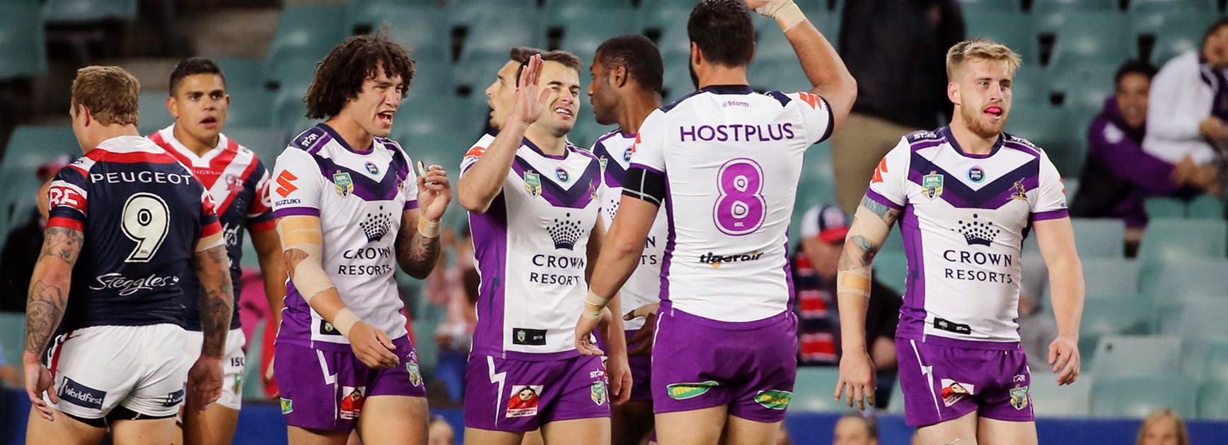 Storm players celebrate during their win over the Roosters in Round 14.