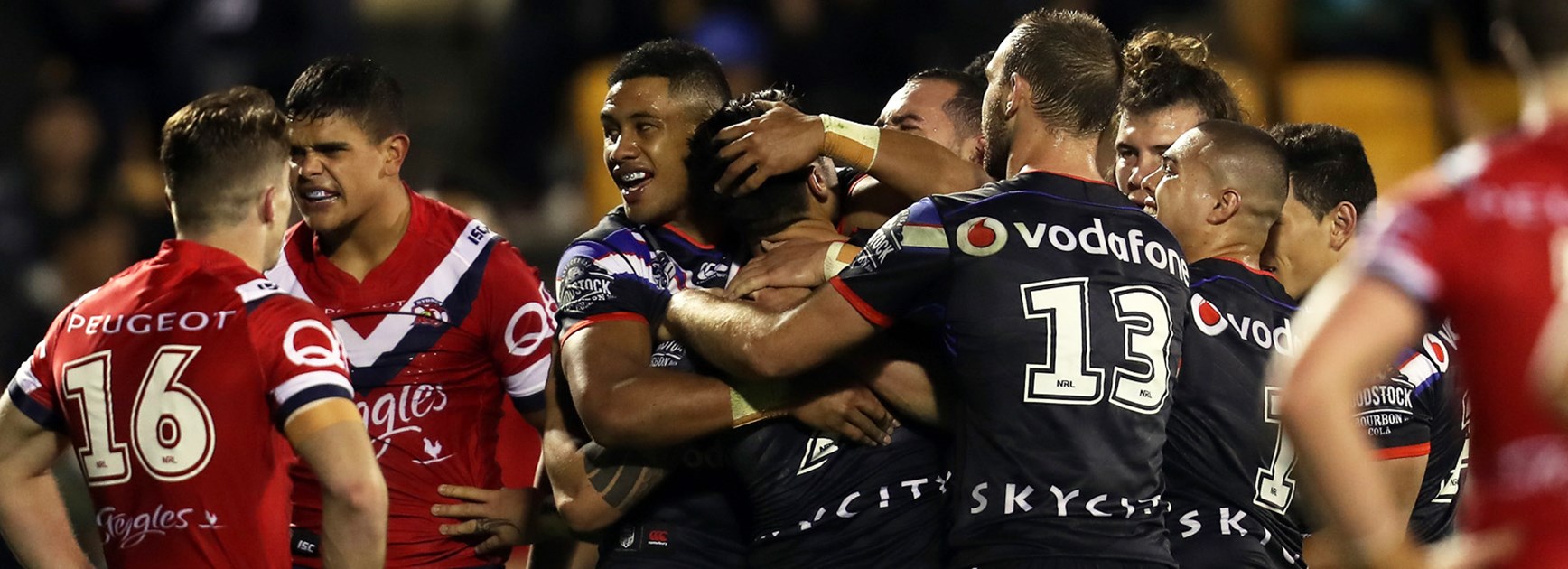 Warriors players celebrate during their Round 15 win over the Roosters.