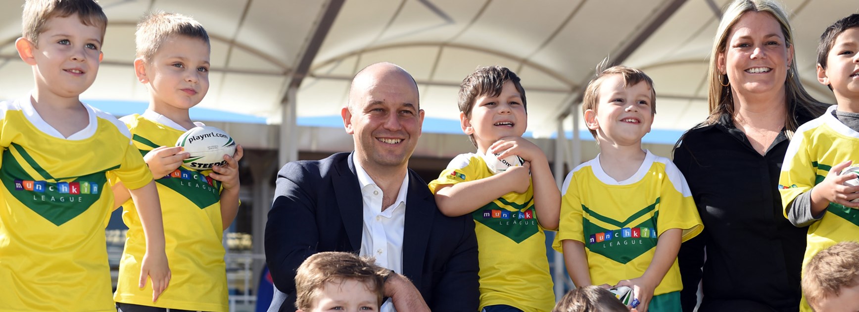 NRL CEO Todd Greenberg and Munchkin League coordinator Debbie Ryan with some of the Gold Coast children already participating in the program.