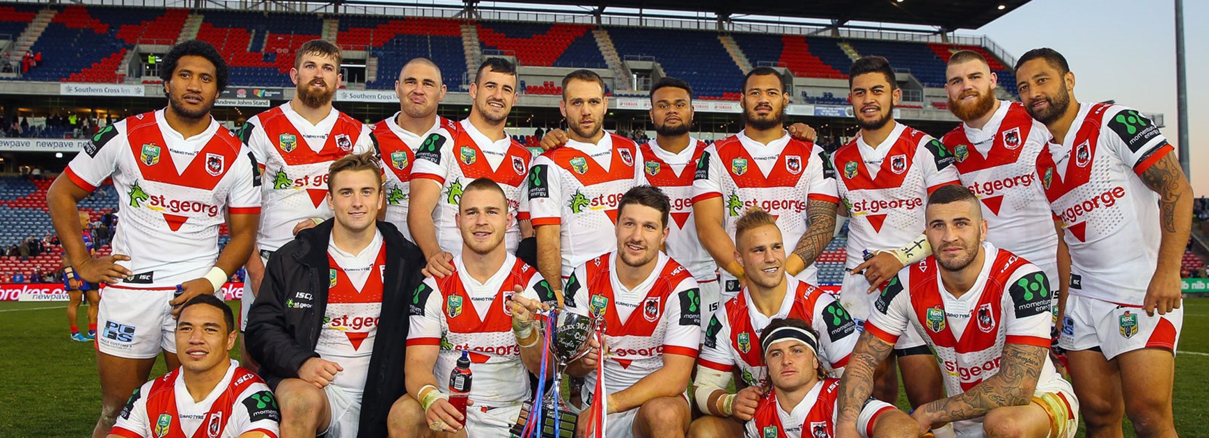 Dragons players with the Alex McKinnon Cup following their win over the Knights.