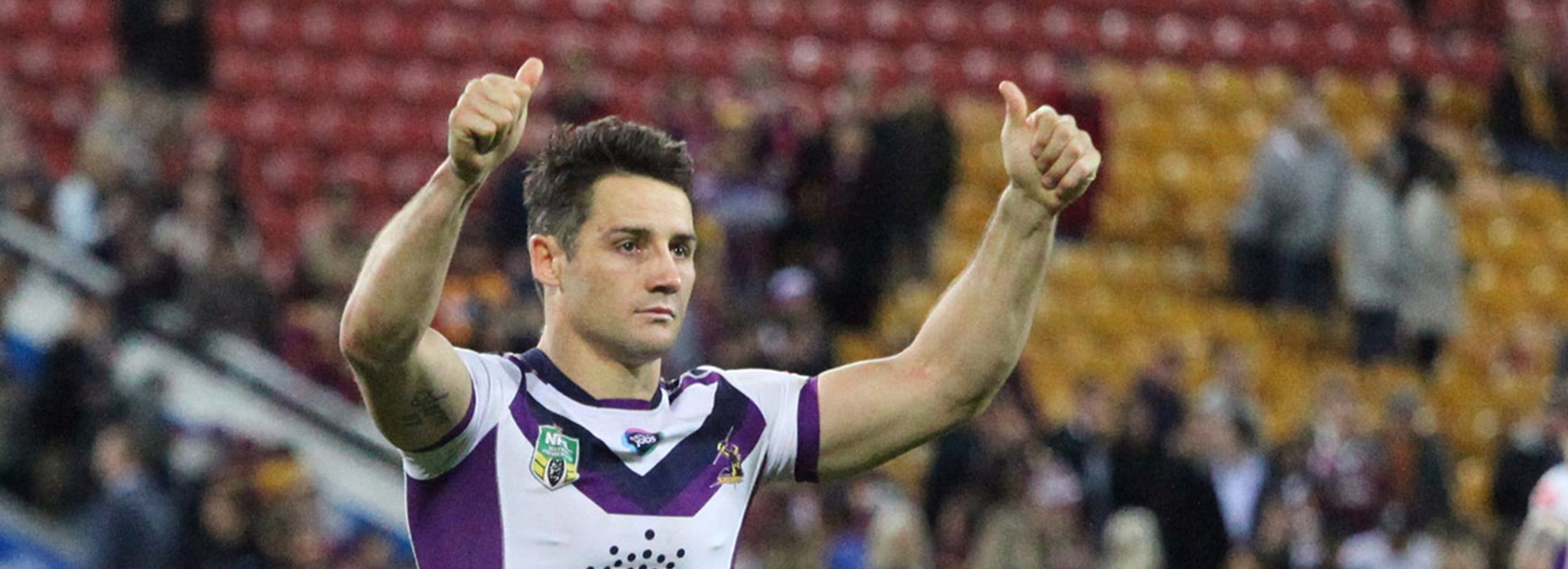 Storm halfback Cooper Cronk salutes the away fans at Suncorp Stadium in Round 17.