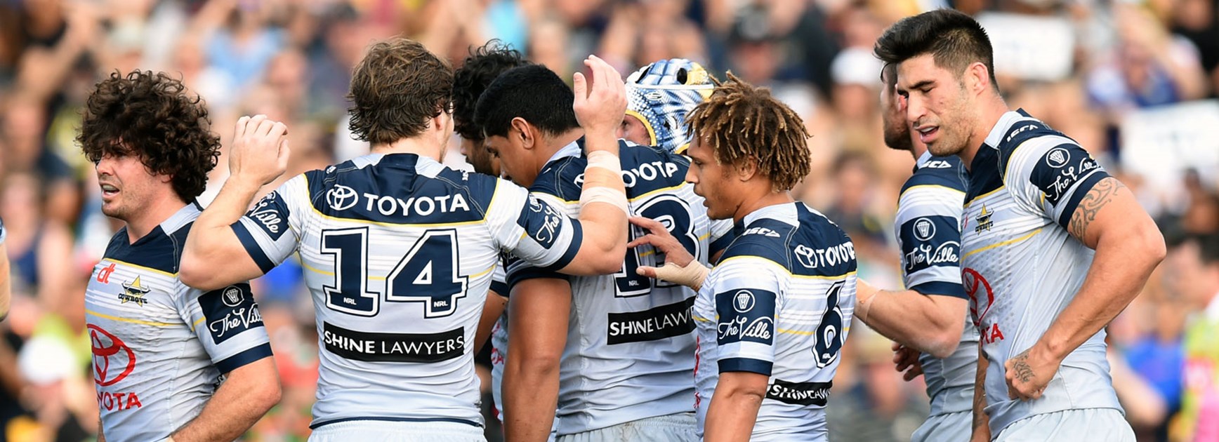 Cowboys players celebrate during their Round 17 victory over the Rabbitohs.
