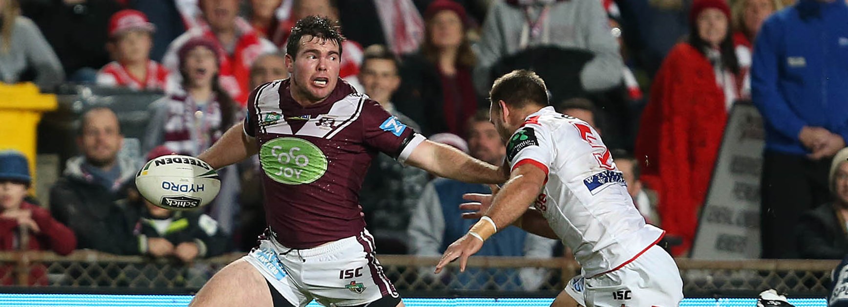 Jamie Lyon makes a break against the Dragons at Brookvale Oval.