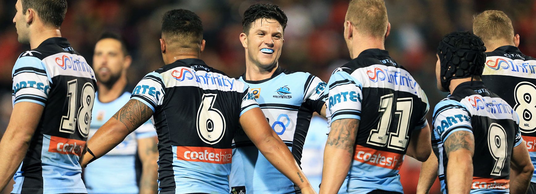Chad Townsend celebrates with his Sharks teammates against the Panthers in Round 18.