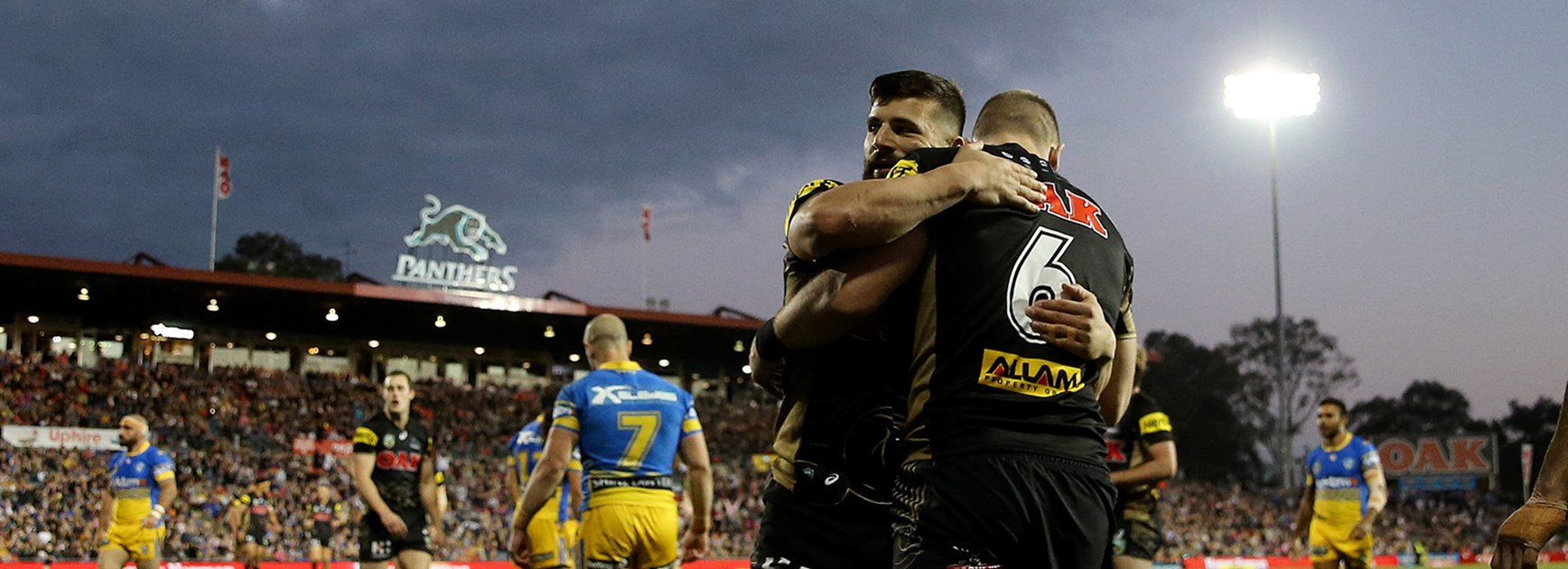 Josh Mansour celebrates with try scorer Bryce Cartwright at Pepper Stadium in Round 19.