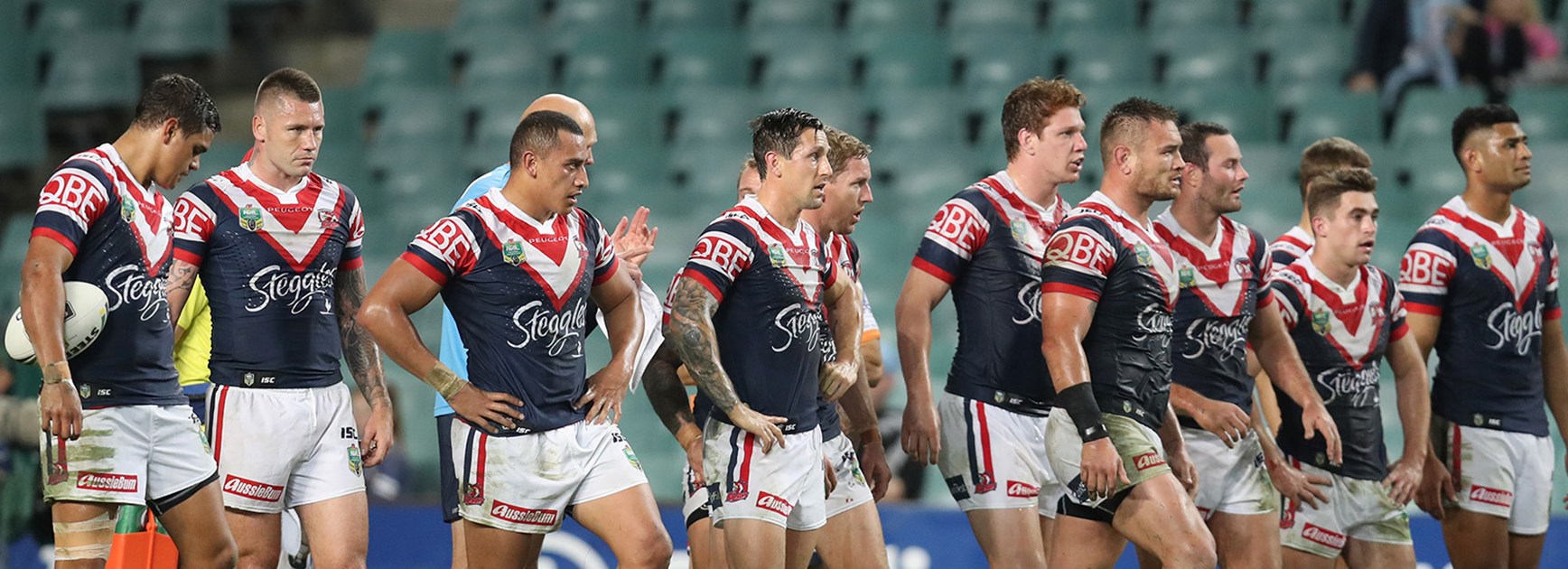 The Roosters look on after another try to the Sharks.