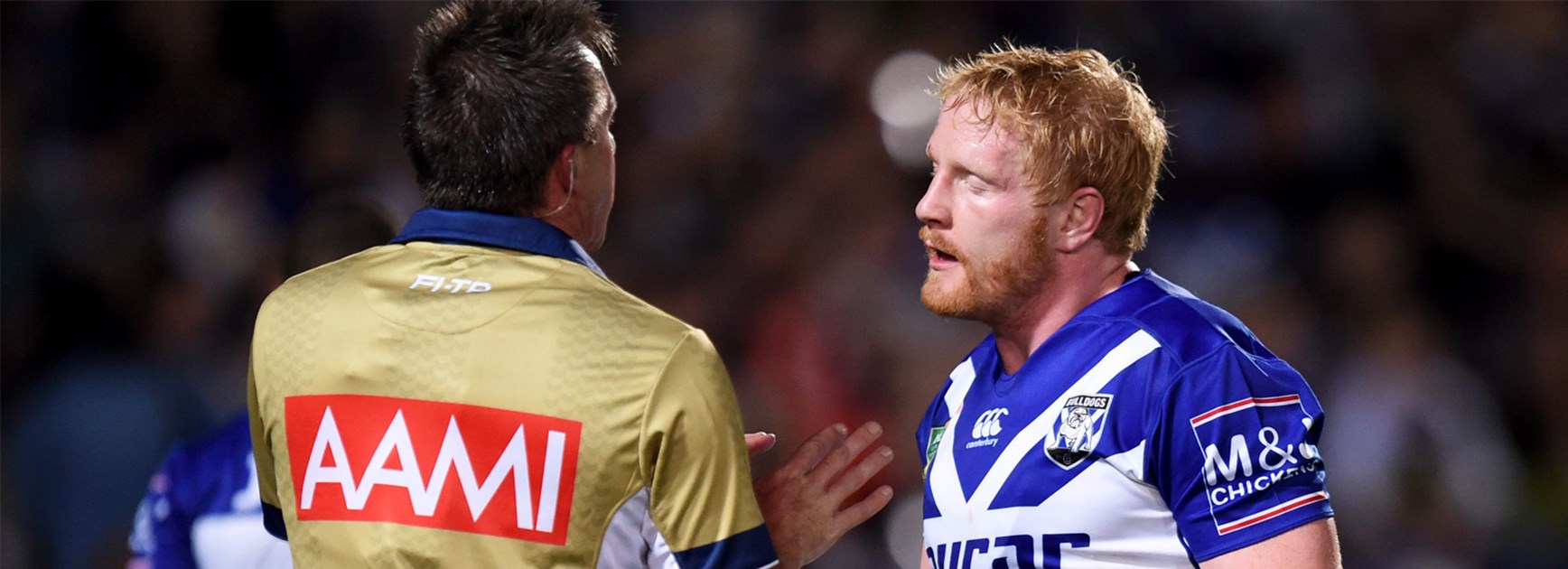 Bulldogs skipper talks with Jared Maxwell during Thursday night's clash with the Cowboys.