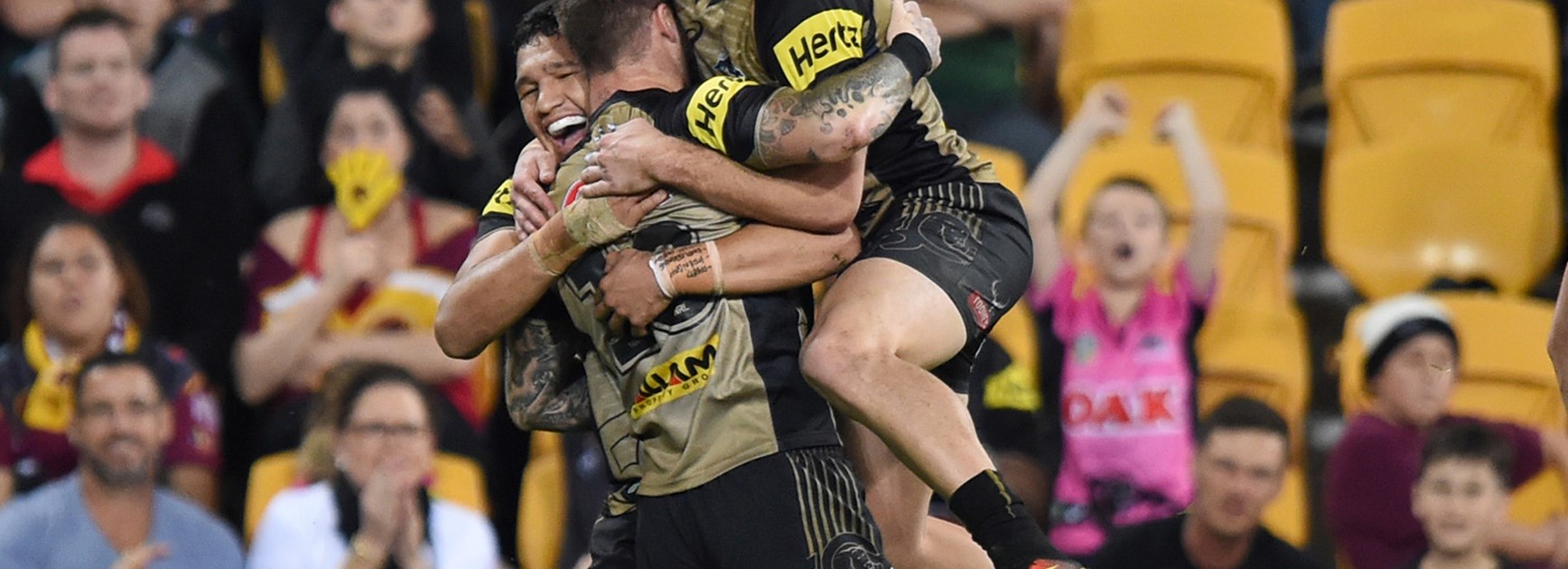The Panthers celebrate a try against the Broncos at Suncorp Stadium on Friday night.