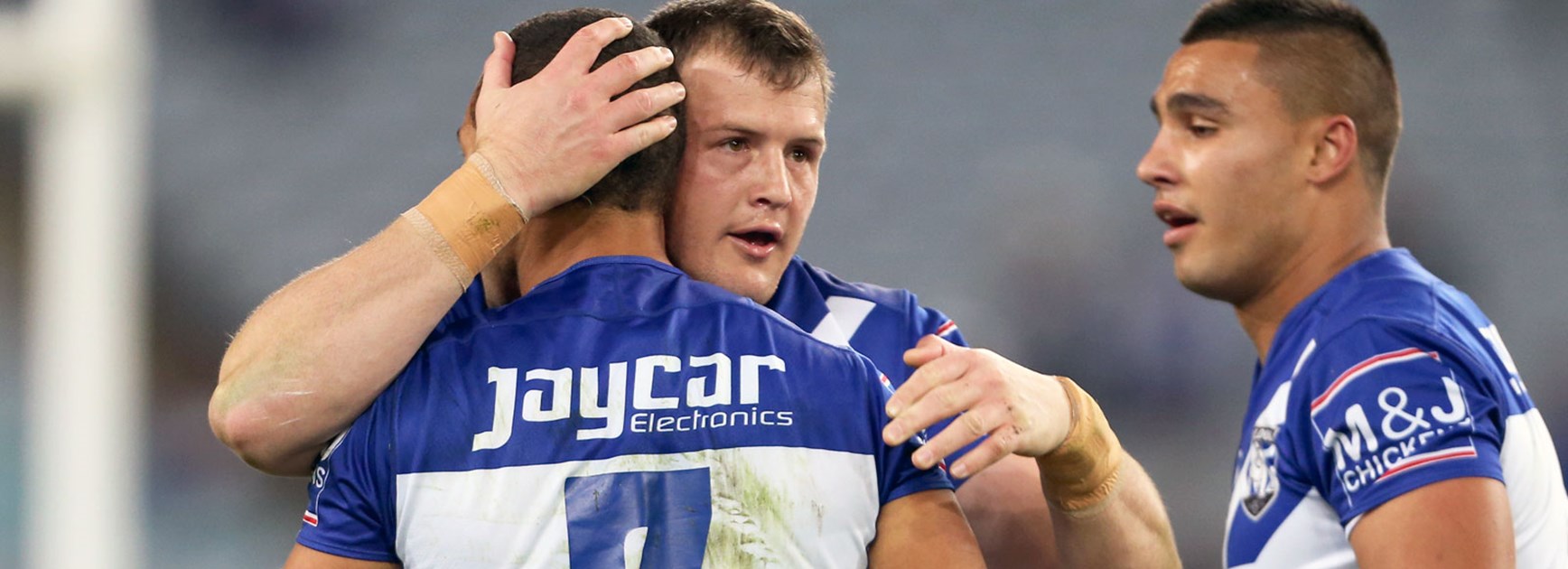 Bulldogs players celebrate against the Dragons in Round 21.