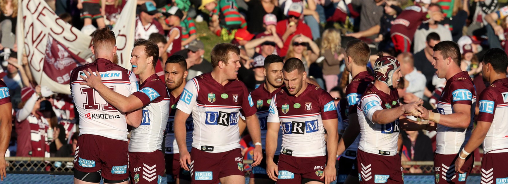 Manly celebrate a try against the Knights at Brookvale Oval in Round 21.