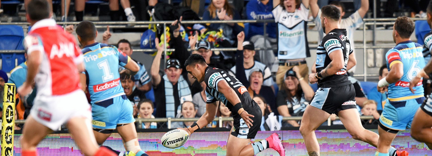 valentine Holmes scores for Cronulla against the Titans on Monday night.