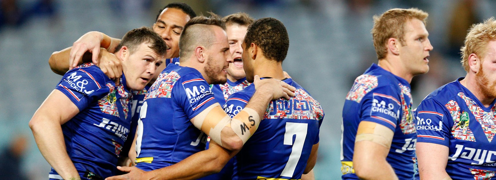Bulldogs players celebrate their Round 23 win over the Sea Eagles.