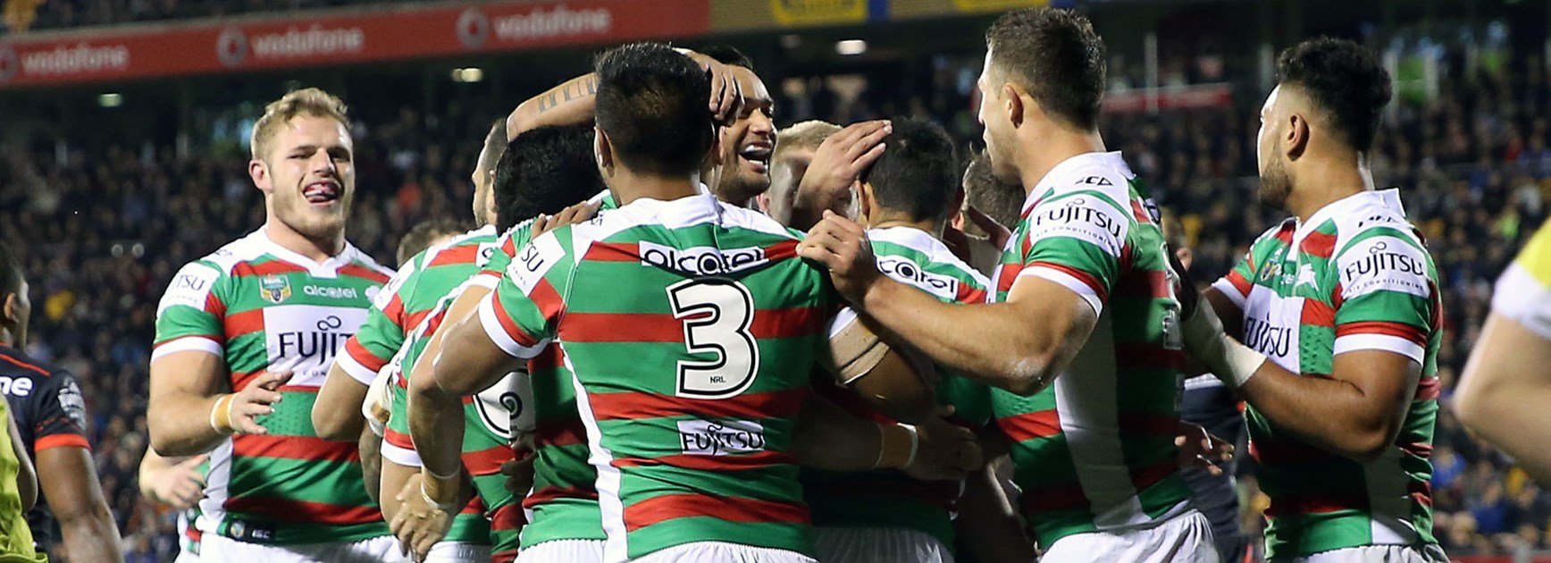 Rabbitohs players celebrate against the Warriors in Round 23.